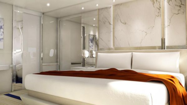 飞机上的双人床毯子下面盖着的就是系在床垫上的大安全带，在飞机遇到强气流时可以把睡觉的人固定在床上。（图片来源：美国《华尔街日报》）