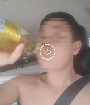 赤膊汉边“灌酒”边开车挑衅交警